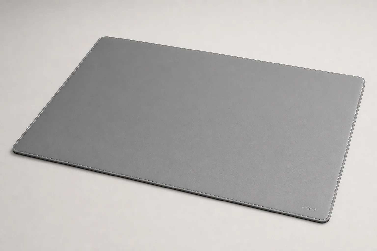 Five standing desk mats displayed on grey concrete surface