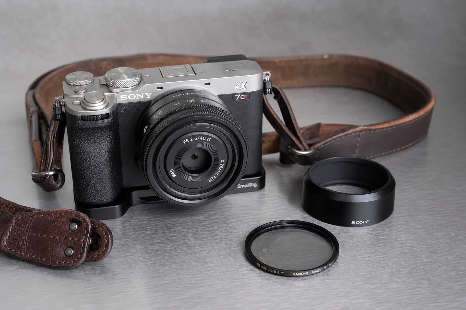 Complete Sony A7CR street photography camera setup with lens, accessories, and vintage strap