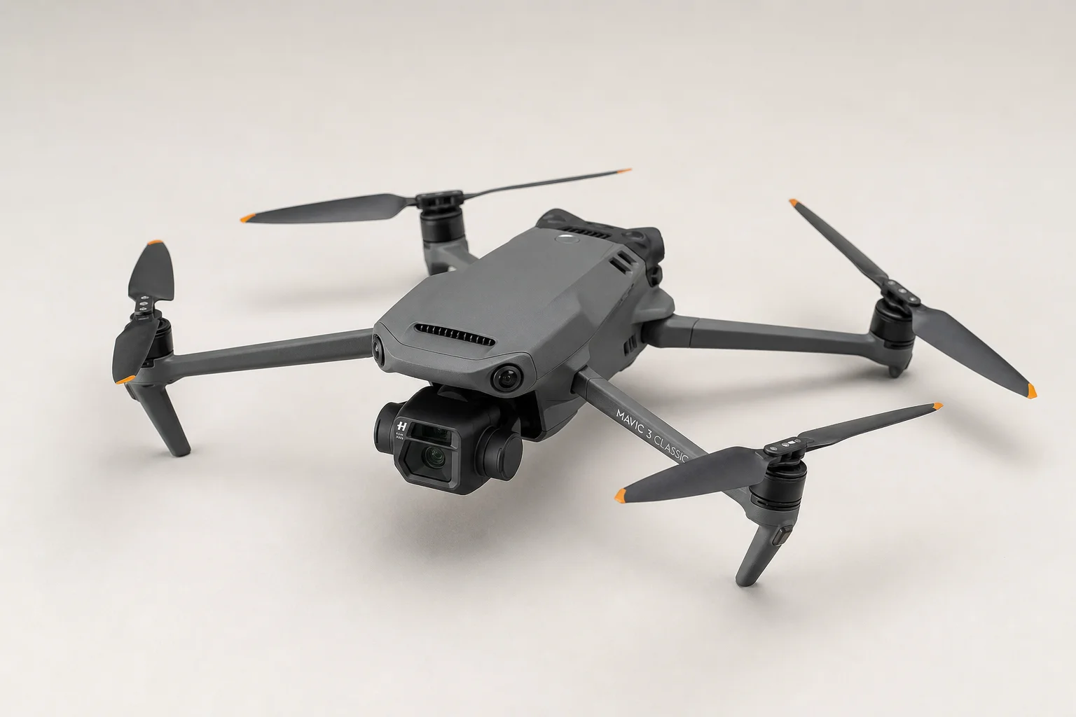 Five drones arranged on concrete surface showing variety from compact to professional models
