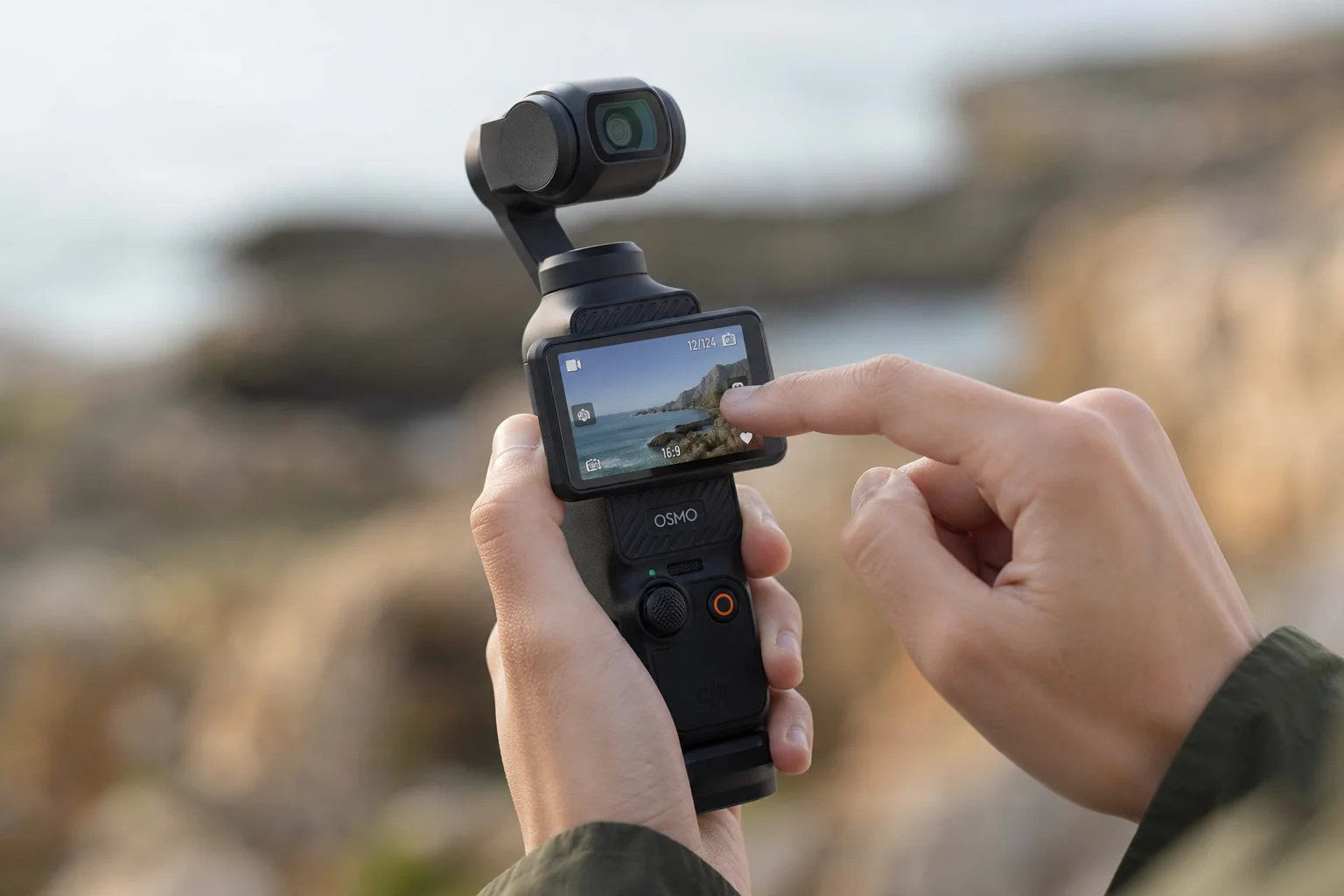 Filmmaker reviewing footage on gimbal camera touchscreen outdoors