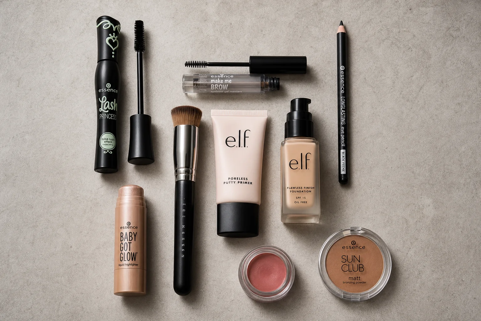 Nine Dollar Tree makeup products arranged on concrete surface