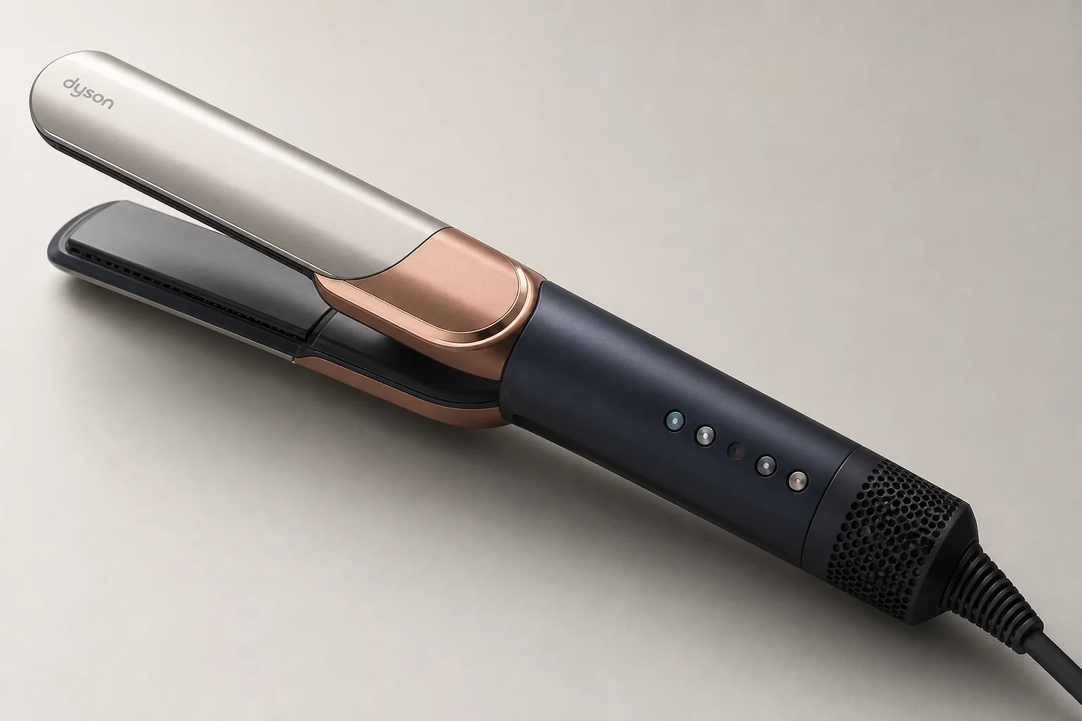 Dyson Airstrait and Dyson Corrale hair styling tools on marble surface