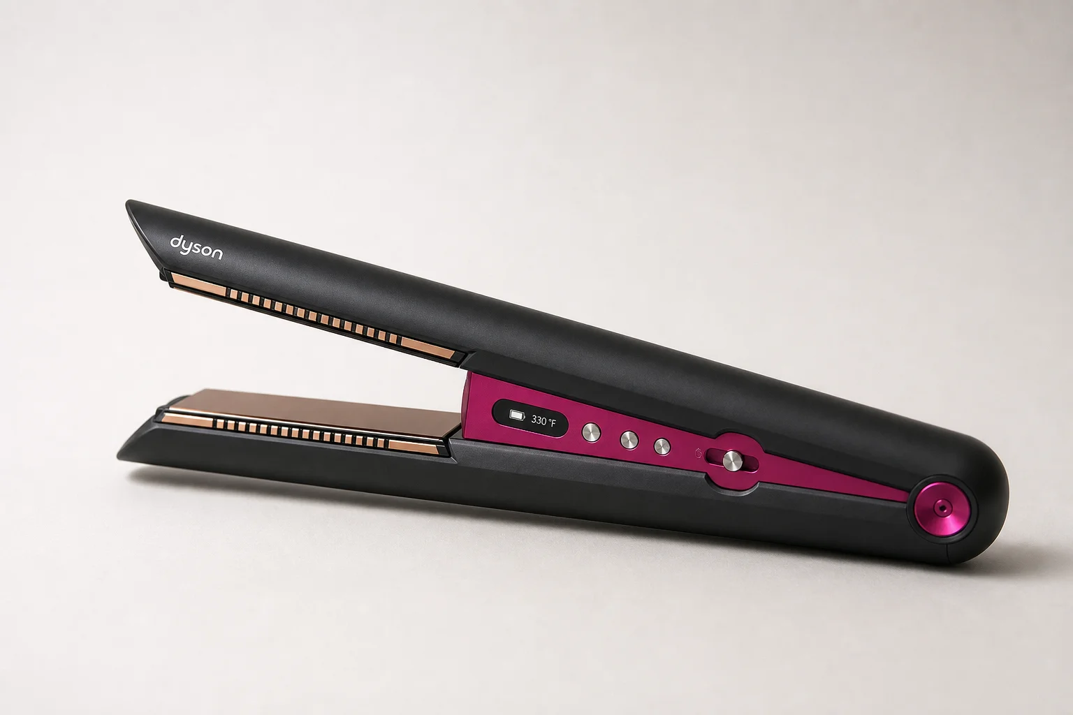 Dyson Airstrait and Dyson Corrale hair styling tools on marble surface