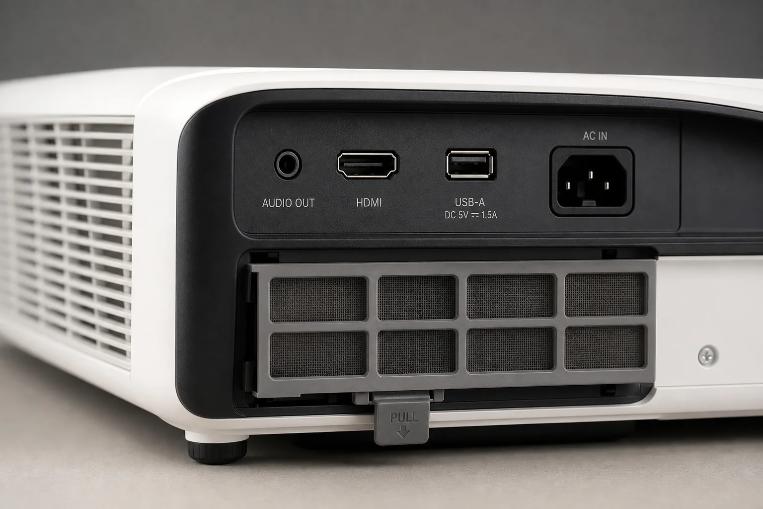 Close-up of projector rear panel showing dust filter and connectivity ports
