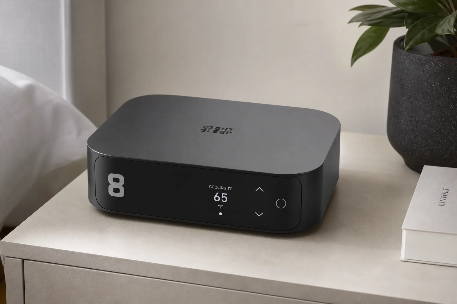 Collection of health monitoring devices including air quality monitor, smartwatch, scale, and sleep technology on wooden surface