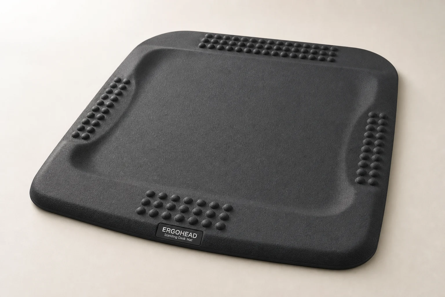 Five standing desk mats displayed on grey concrete surface