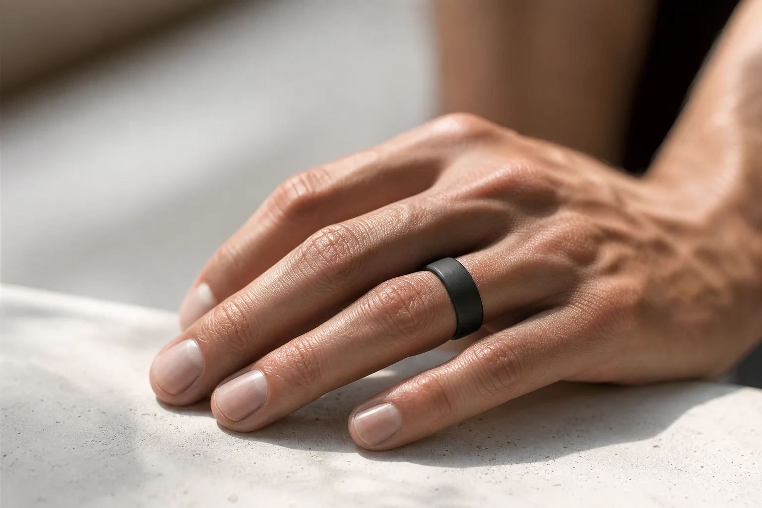 Close-up of wearable ring on runner's hand during rest