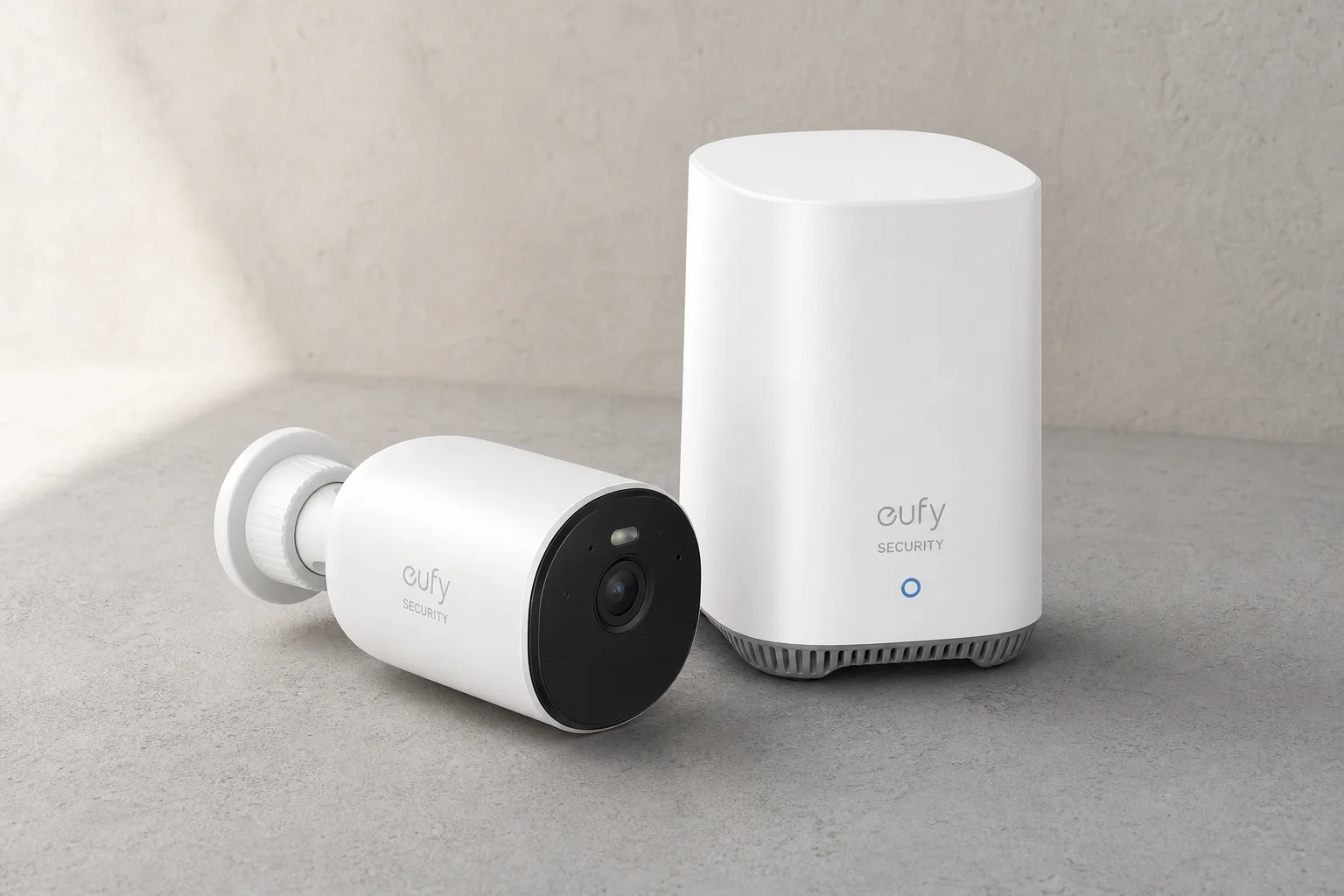 Five home security cameras arranged on concrete surface representing budget to premium options