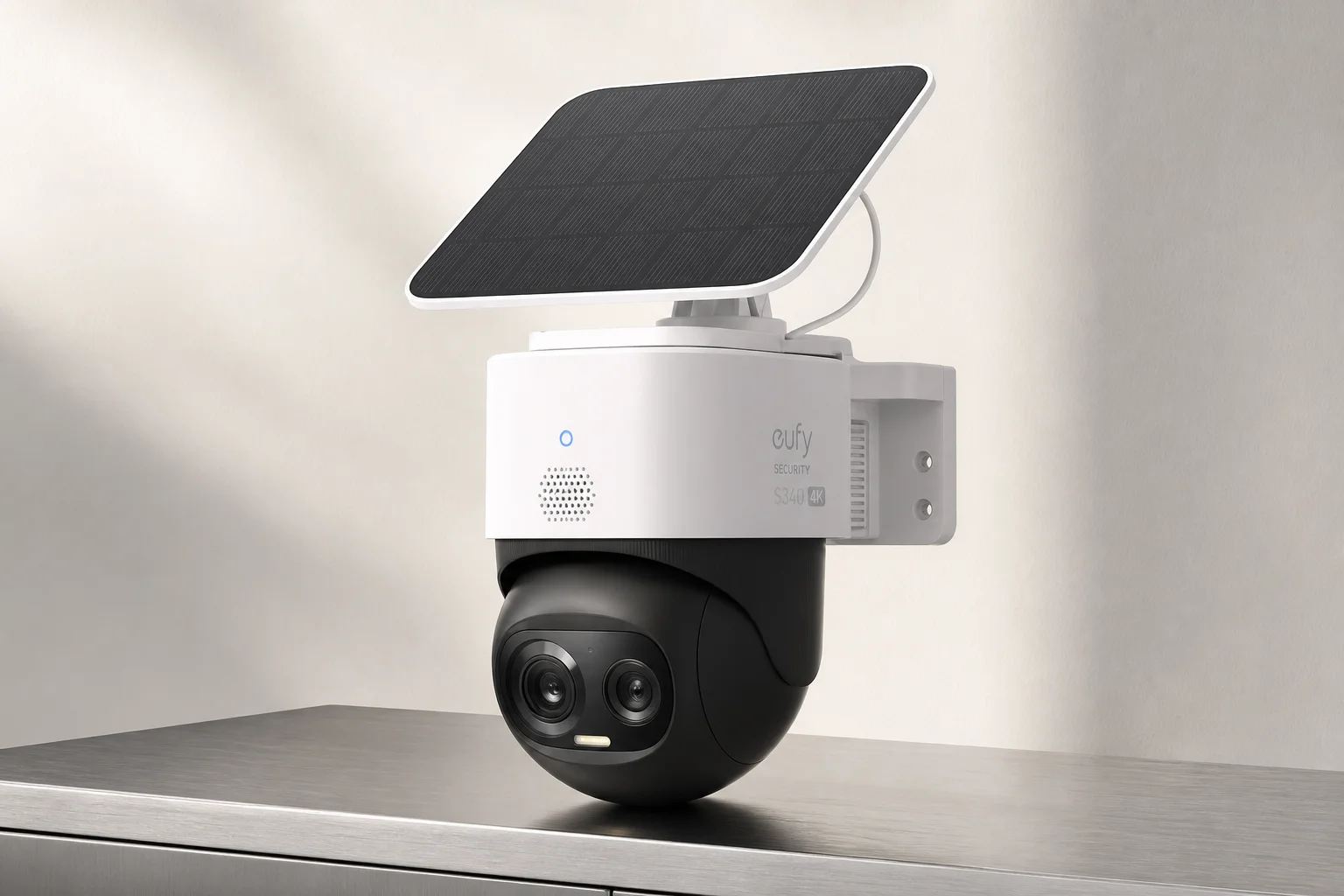 Eufy security camera system devices including HomeBase 3, doorbell, pan-tilt camera, and floodlight on concrete
