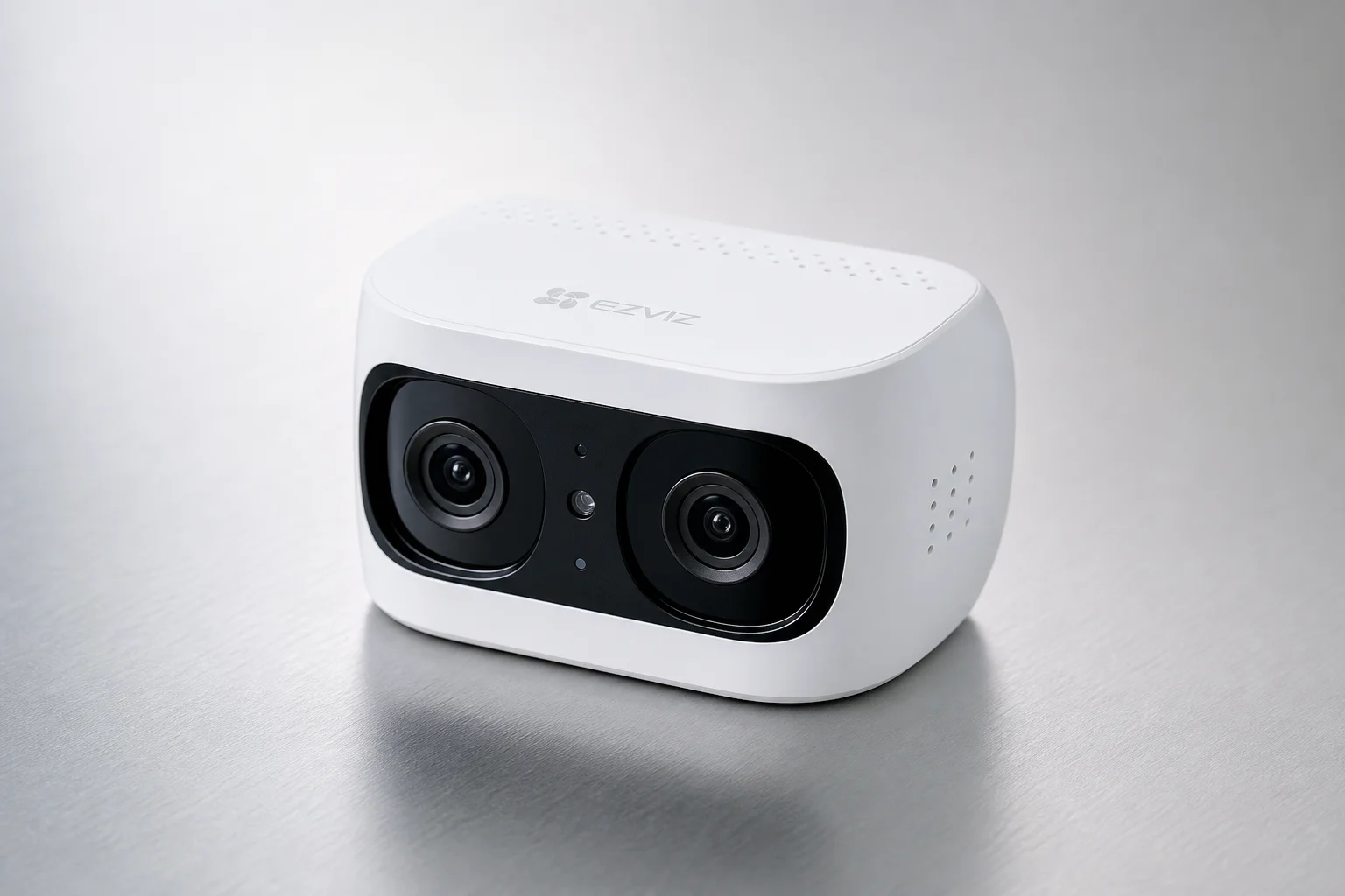 Quatre produits de sécurité disposés sur du béton : caméra double objectif Ezviz, switch D-Link, NVR Hikvision et caméra Imou