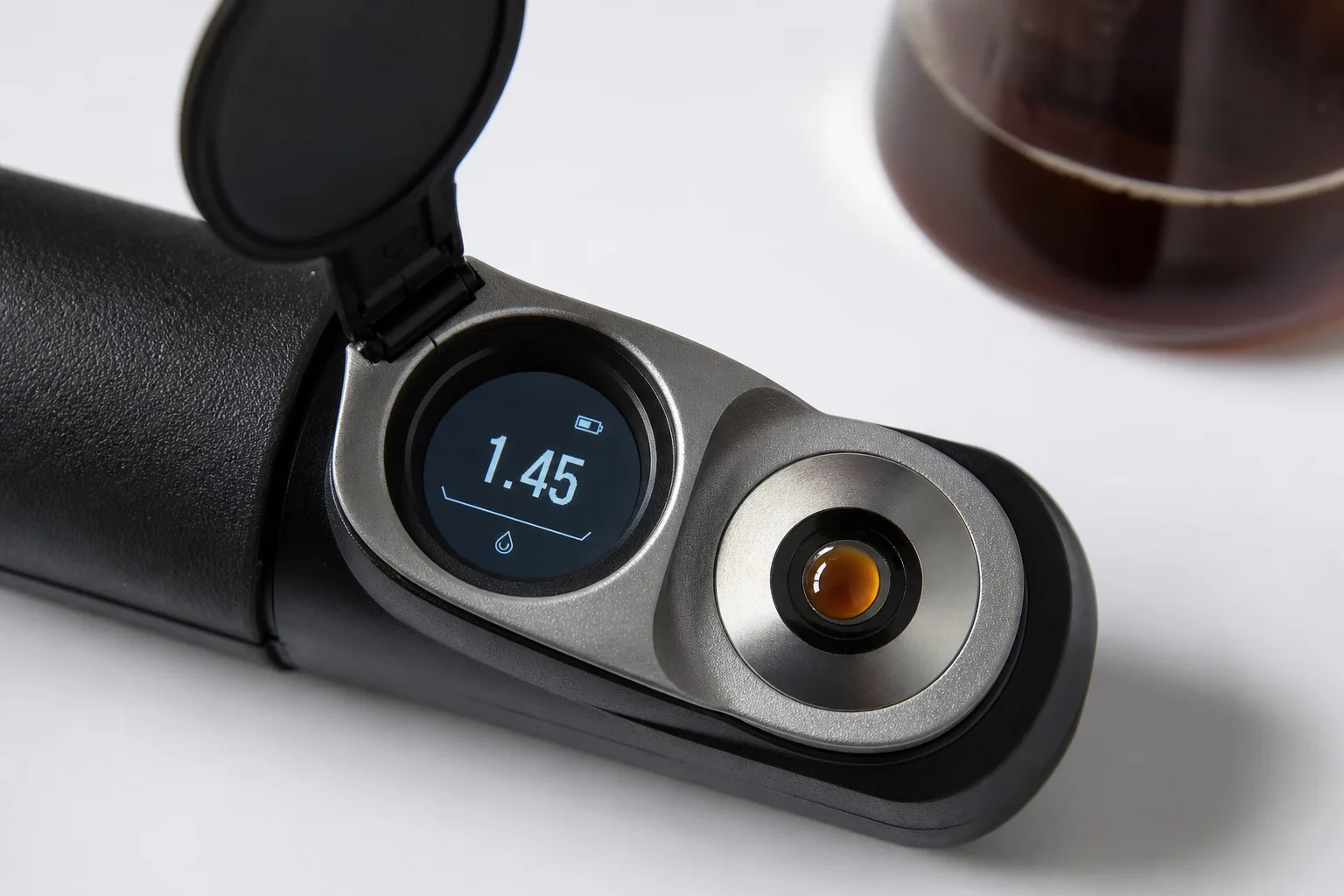 Refractometer measuring coffee concentration with numerical display