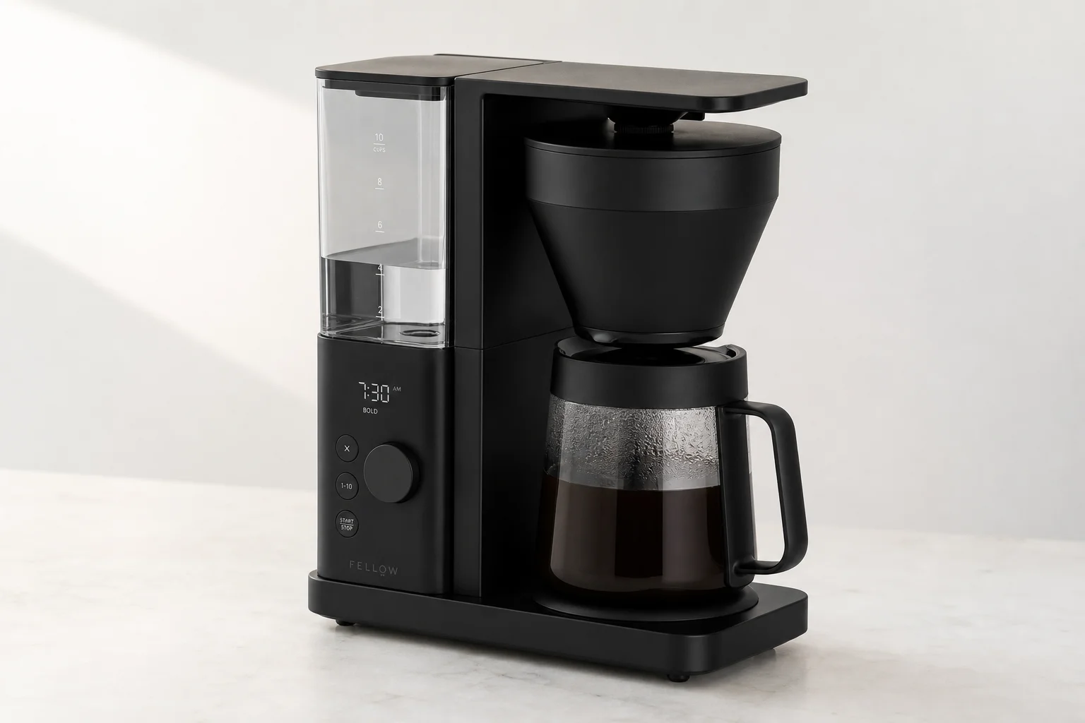 Fellow Aiden Precision coffee maker on neutral surface with display and controls visible