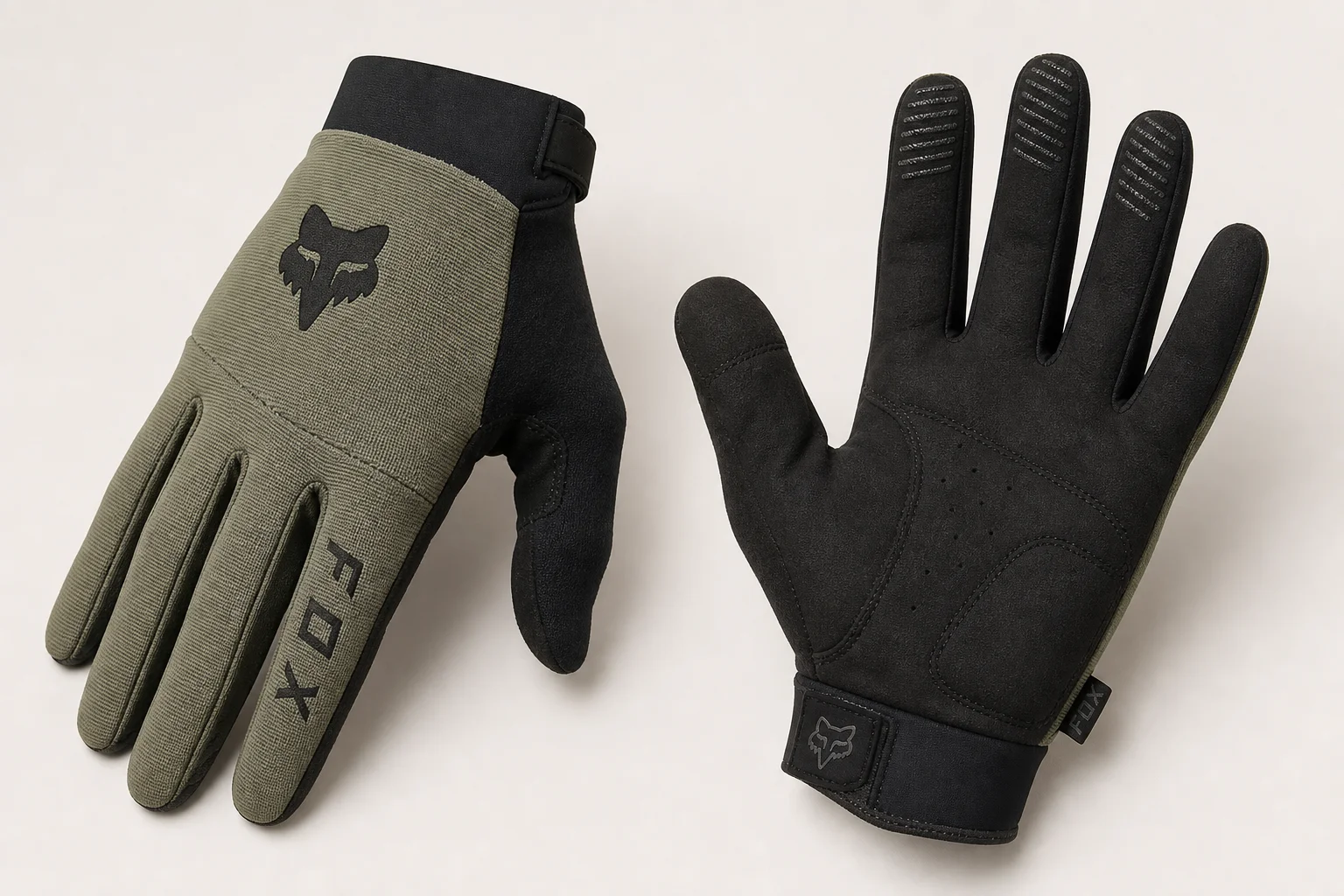 Five mountain bike gloves arranged on concrete showing different designs and protection levels