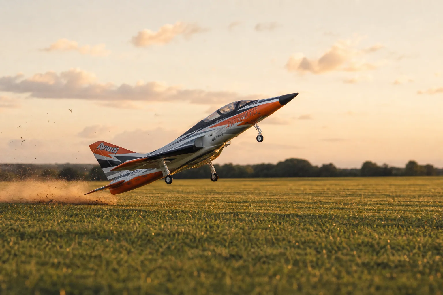 RC jet launching from grass field with full throttle takeoff