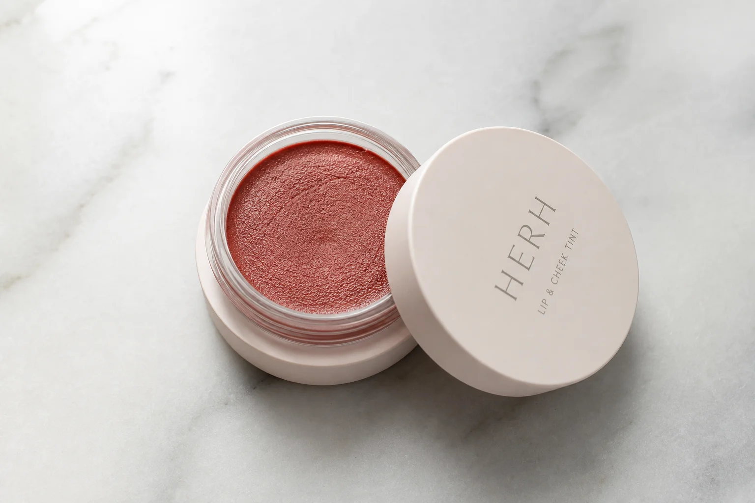 Collection of ten Korean beauty products arranged on marble surface