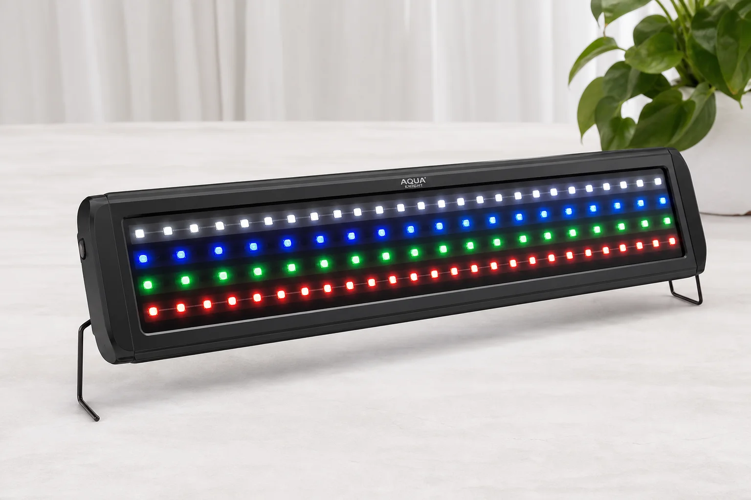 Five aquarium LED light fixtures displayed on concrete surface showing various designs and finishes