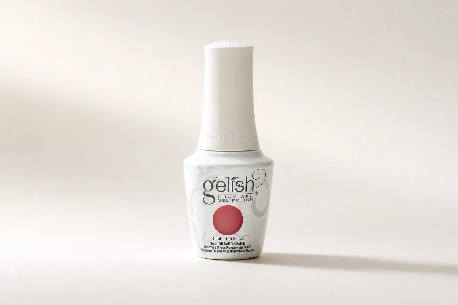 Gel polish bottles ranging from budget to premium brands arranged on marble surface