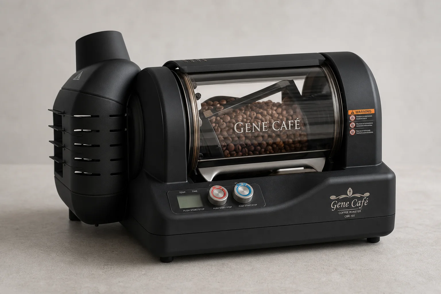 Five home coffee roasters arranged in a line showing size and design progression
