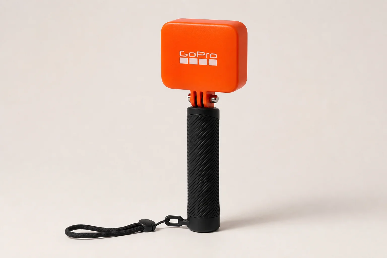 Collection of GoPro accessories including backpack, extension pole, mounts, and floaty on concrete surface