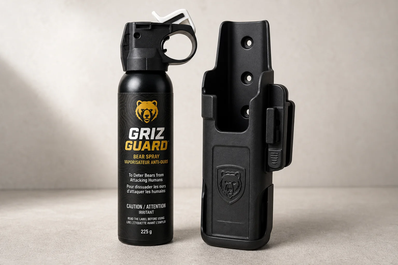 Five bear spray cans of varying sizes arranged on concrete surface