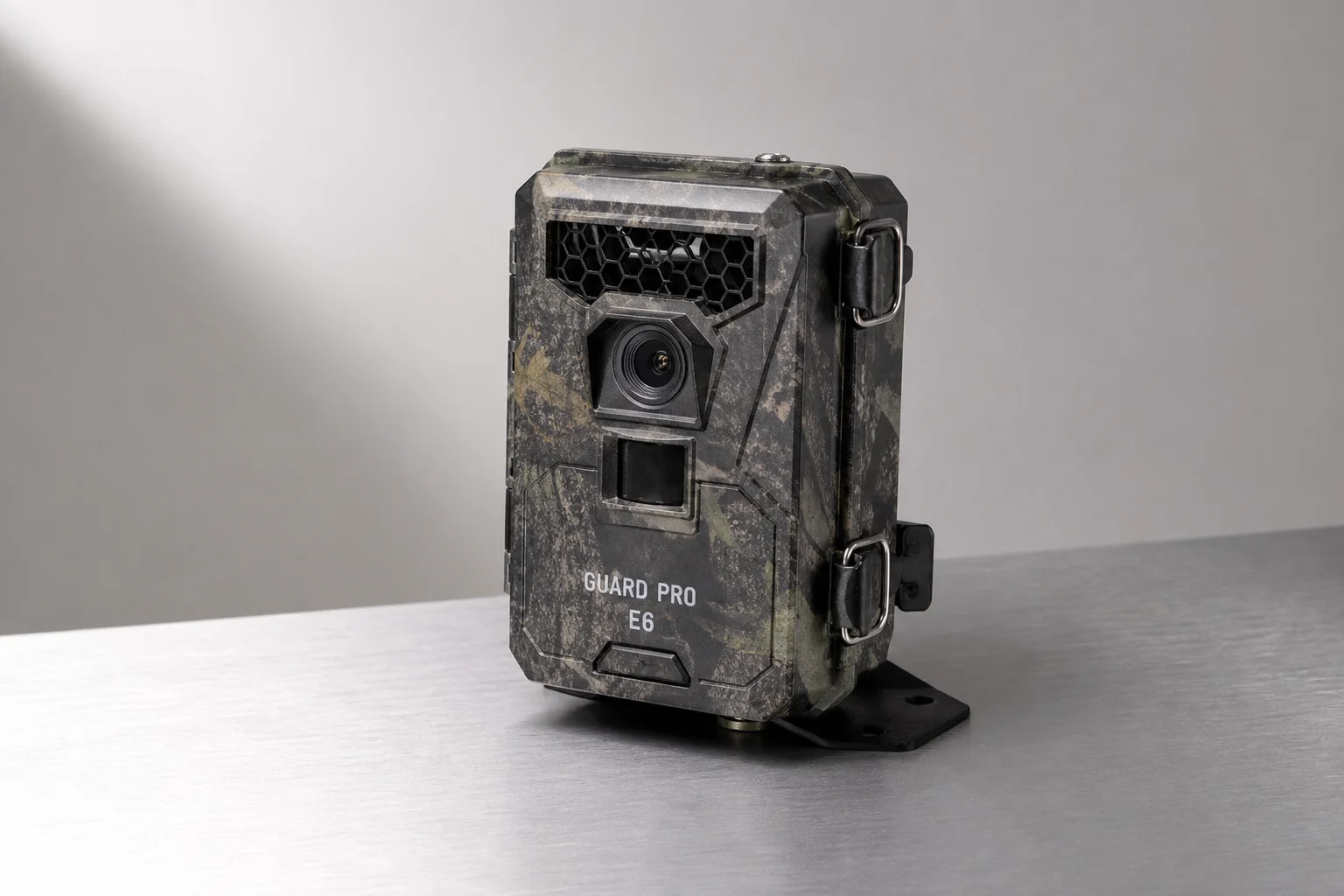 Five trail cameras in various designs arranged on concrete surface
