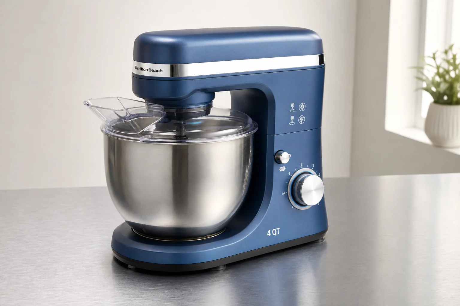 Five stand mixers in various styles and finishes arranged on concrete surface