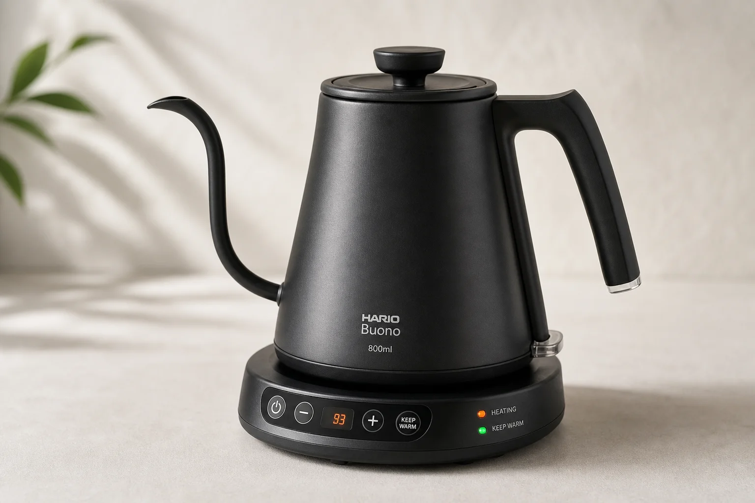 Eight electric gooseneck kettles arranged on concrete surface showing different designs and finishes