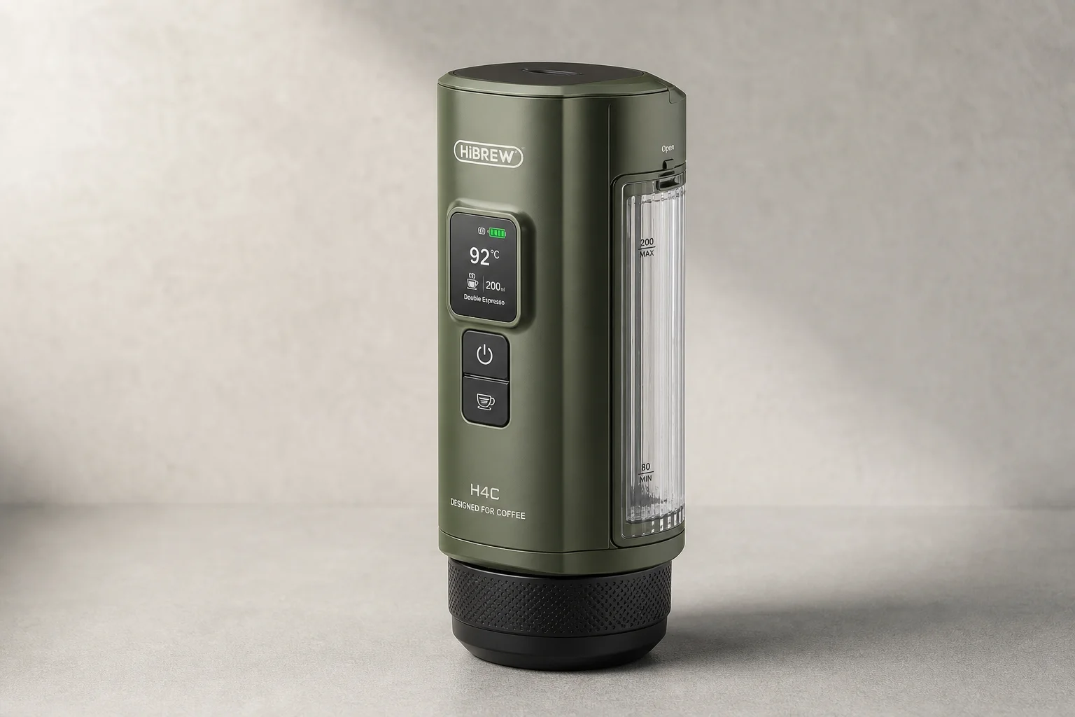 HiBREW H4C portable espresso maker in green on neutral backdrop