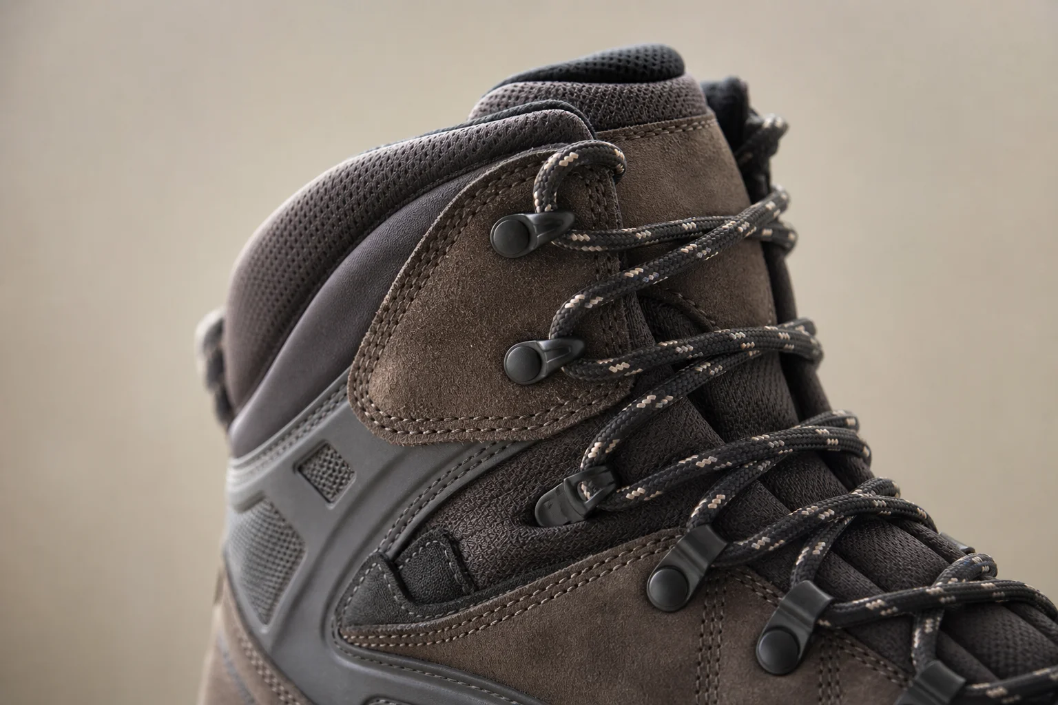 Close-up of hiking boot ankle collar showing lacing and material coverage