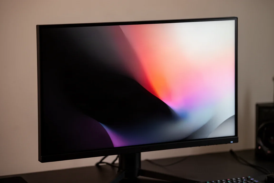 Gaming monitor with RGB miniLED backlight displaying a colorful abstract scene