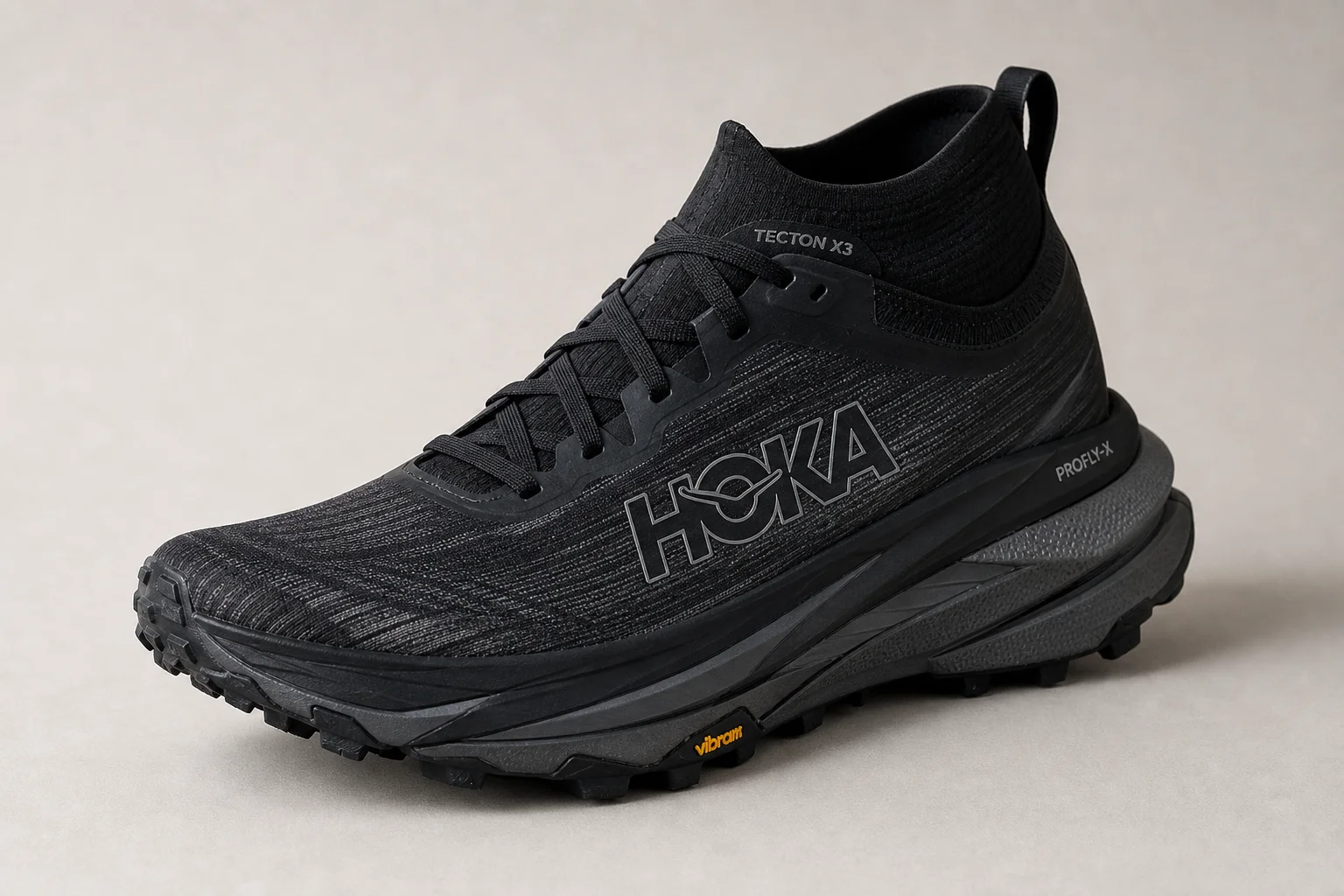 La Sportiva Prodigio Pro and Hoka Tecton X3 trail running shoes side by side on neutral backdrop