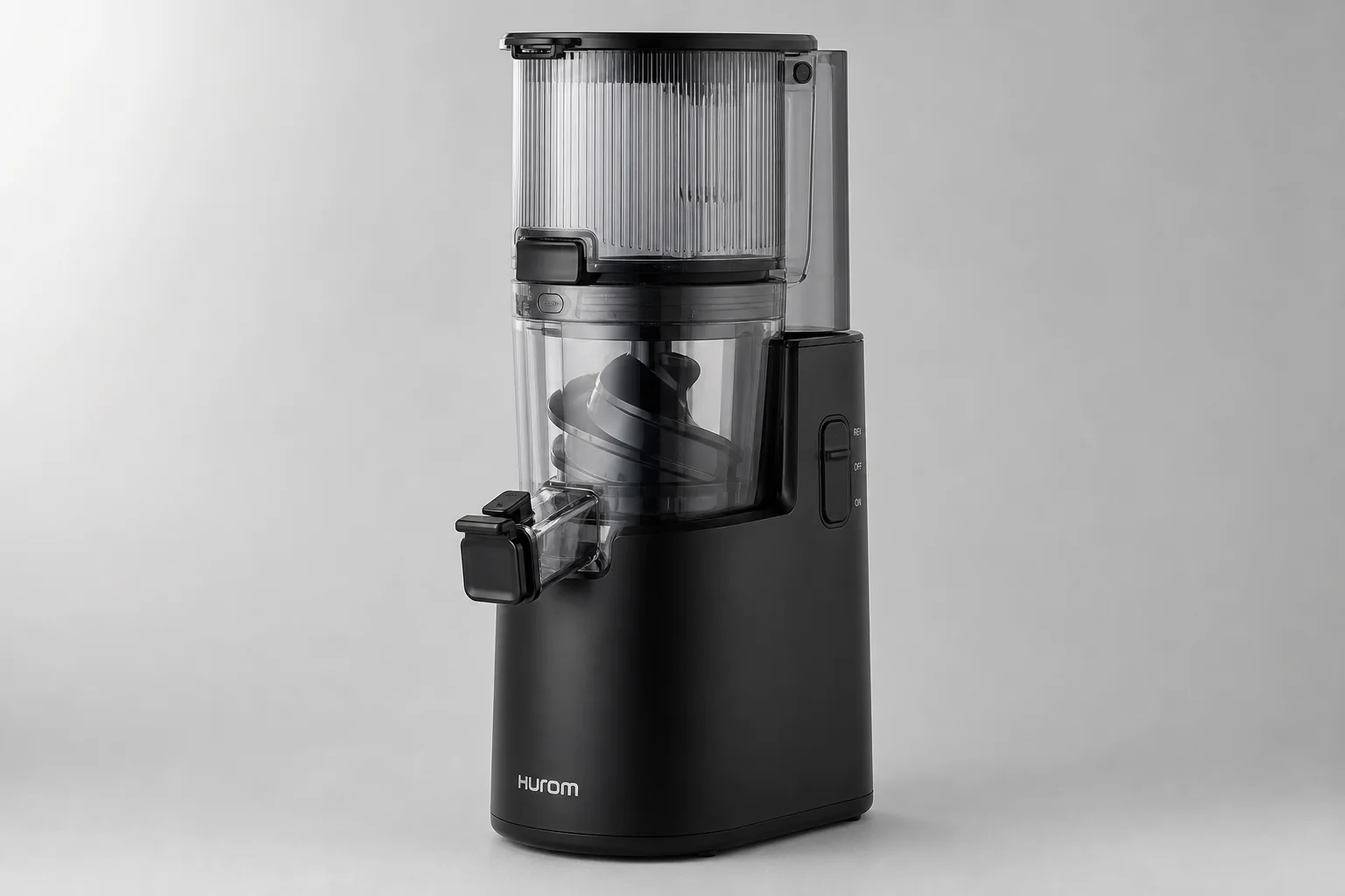Four cold press juicers lined up on concrete: Hurom H70, H400, Nama J2, and Kuvings AUTO10