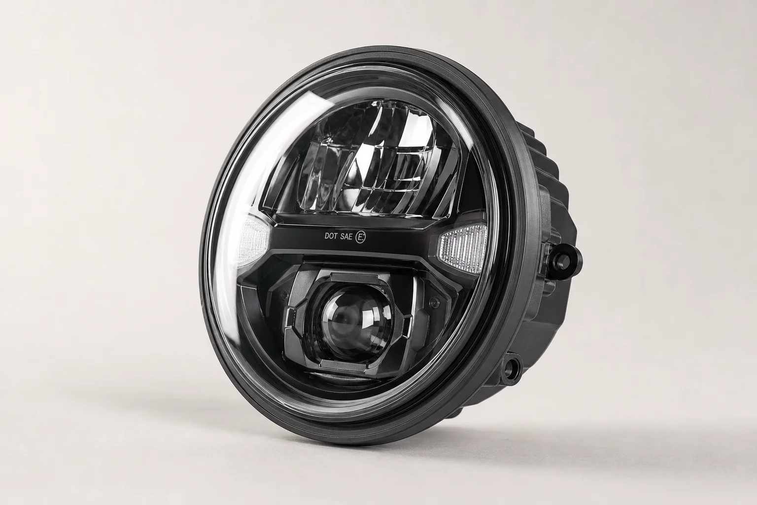 Five LED and drop-in headlights arranged on concrete surface