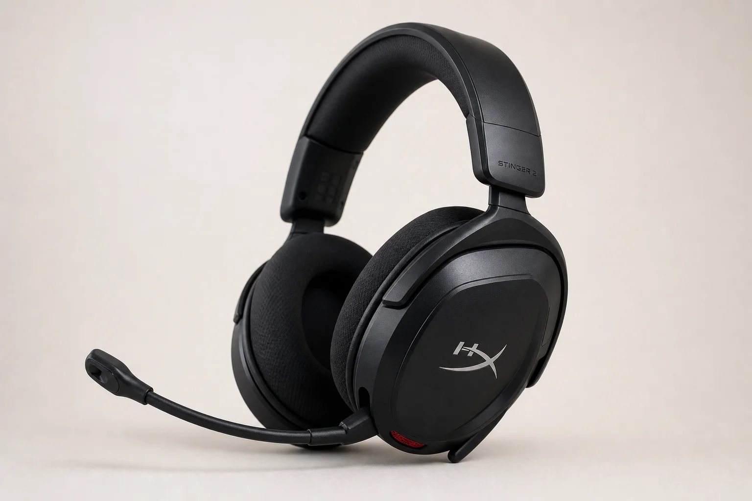Six budget gaming headsets arranged on concrete surface