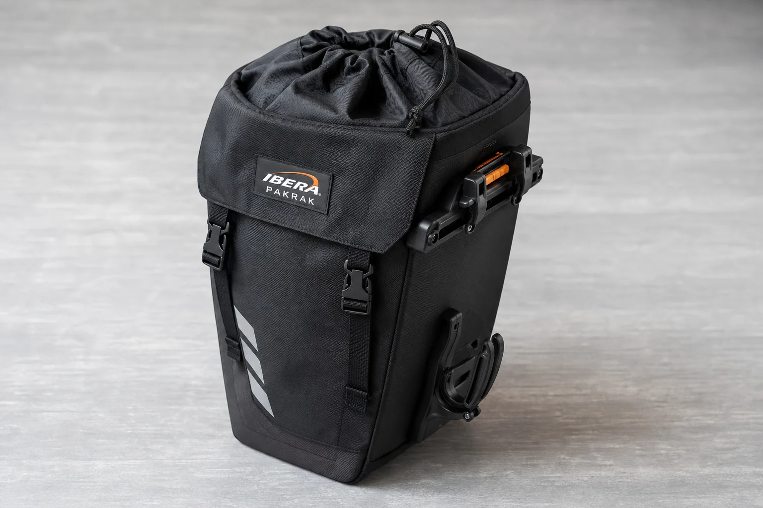 Ibera PakRak and Arkel Orca panniers side by side on neutral backdrop