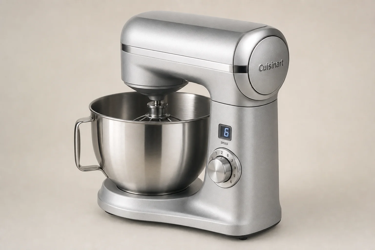 Five stand mixers in various styles and finishes arranged on concrete surface