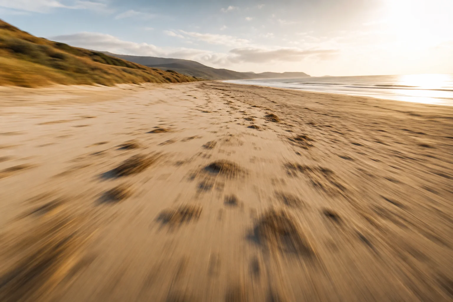 手持錄影防手震測試，顯示在沙地地形上平滑的移動畫面