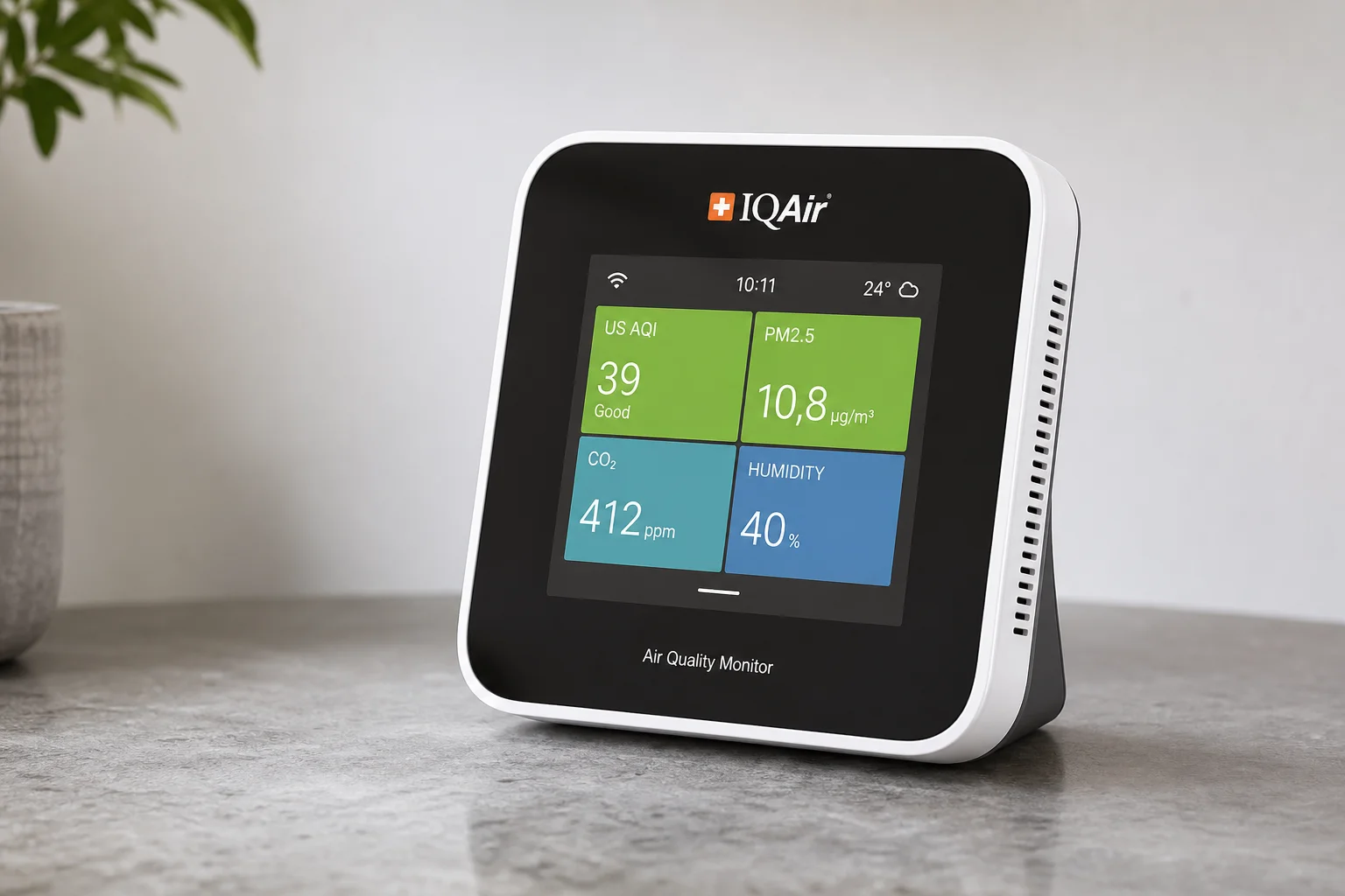 Collection of health monitoring devices including air quality monitor, smartwatch, scale, and sleep technology on wooden surface