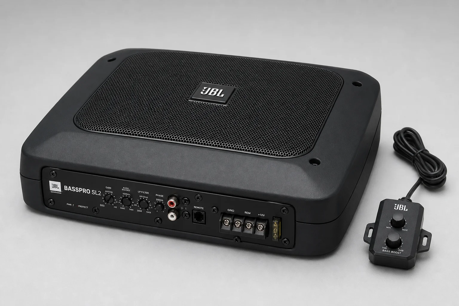 Five compact under-seat subwoofers arranged on dark surface showing various models and sizes