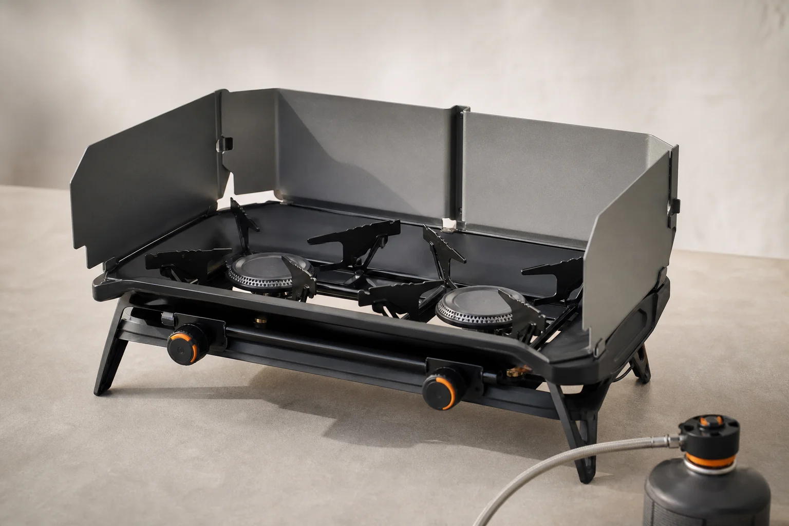 Jetboil Genesis windshield attachment clipped around the dual burners