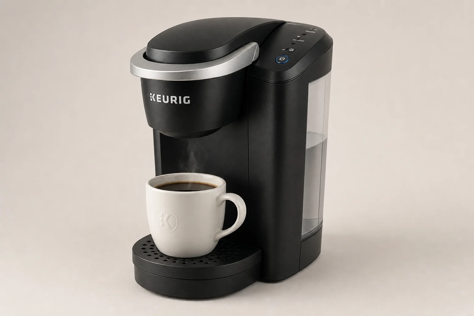 Five different Keurig coffee maker models arranged on a grey surface
