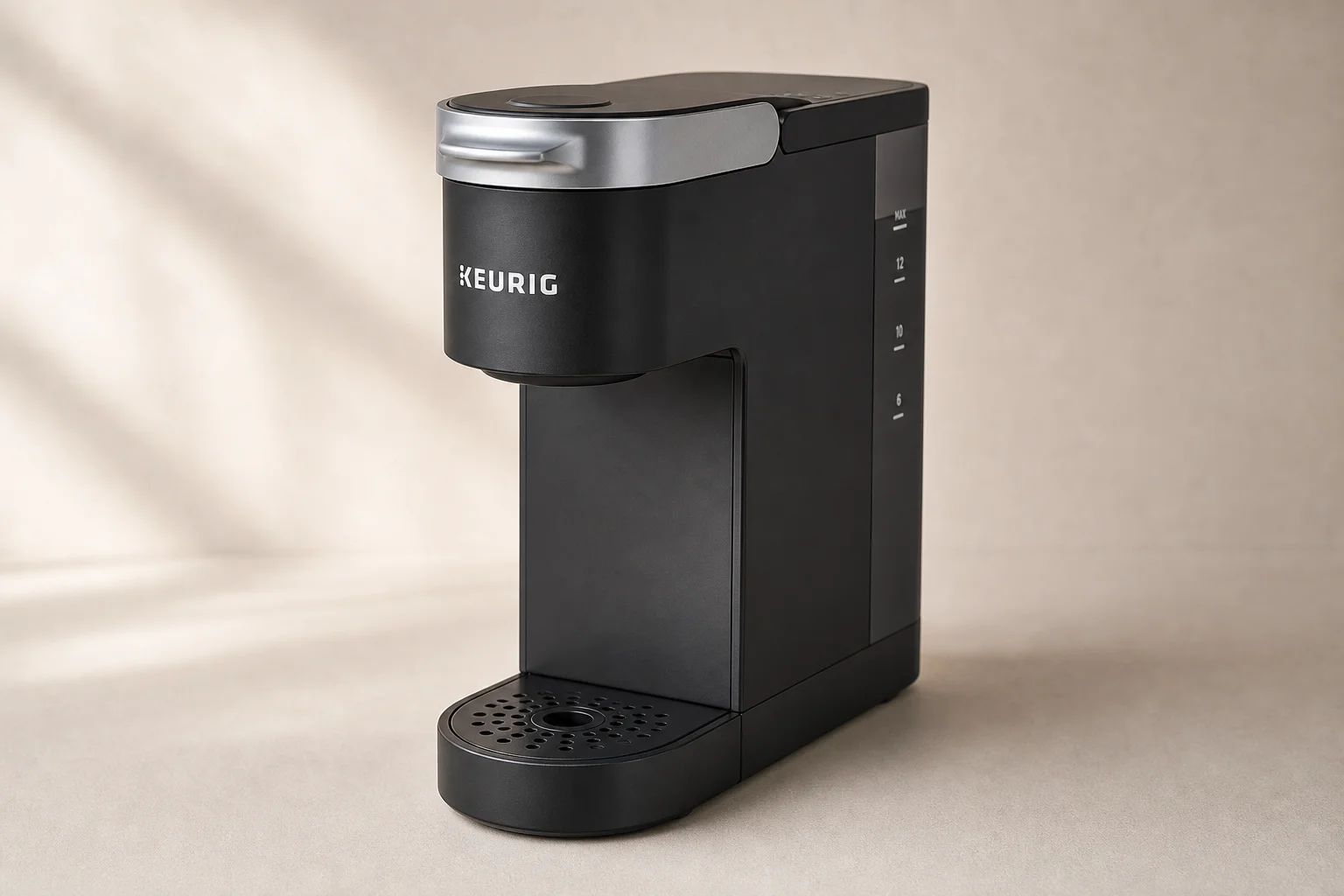 Five different Keurig coffee maker models arranged on a grey surface