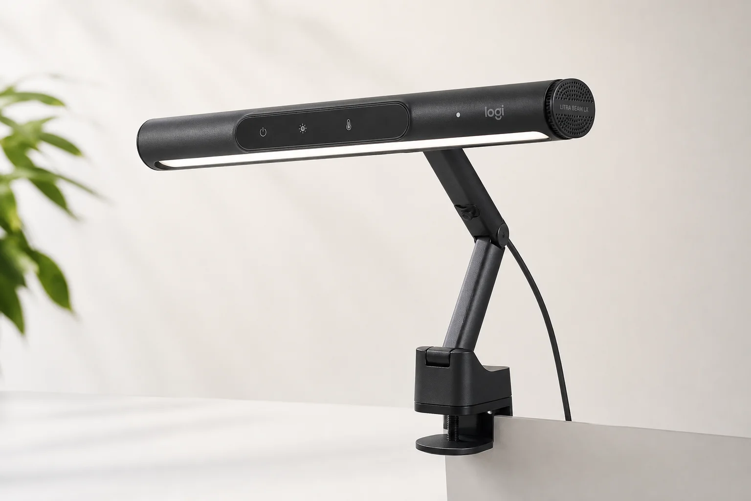 Complete modern desk setup with walnut desk, monitor, chair, speakers, and accessories