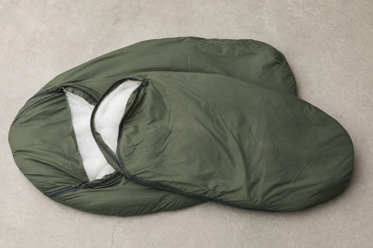 Layered sleeping bags showing patrol and intermediate bag construction and relative sizes