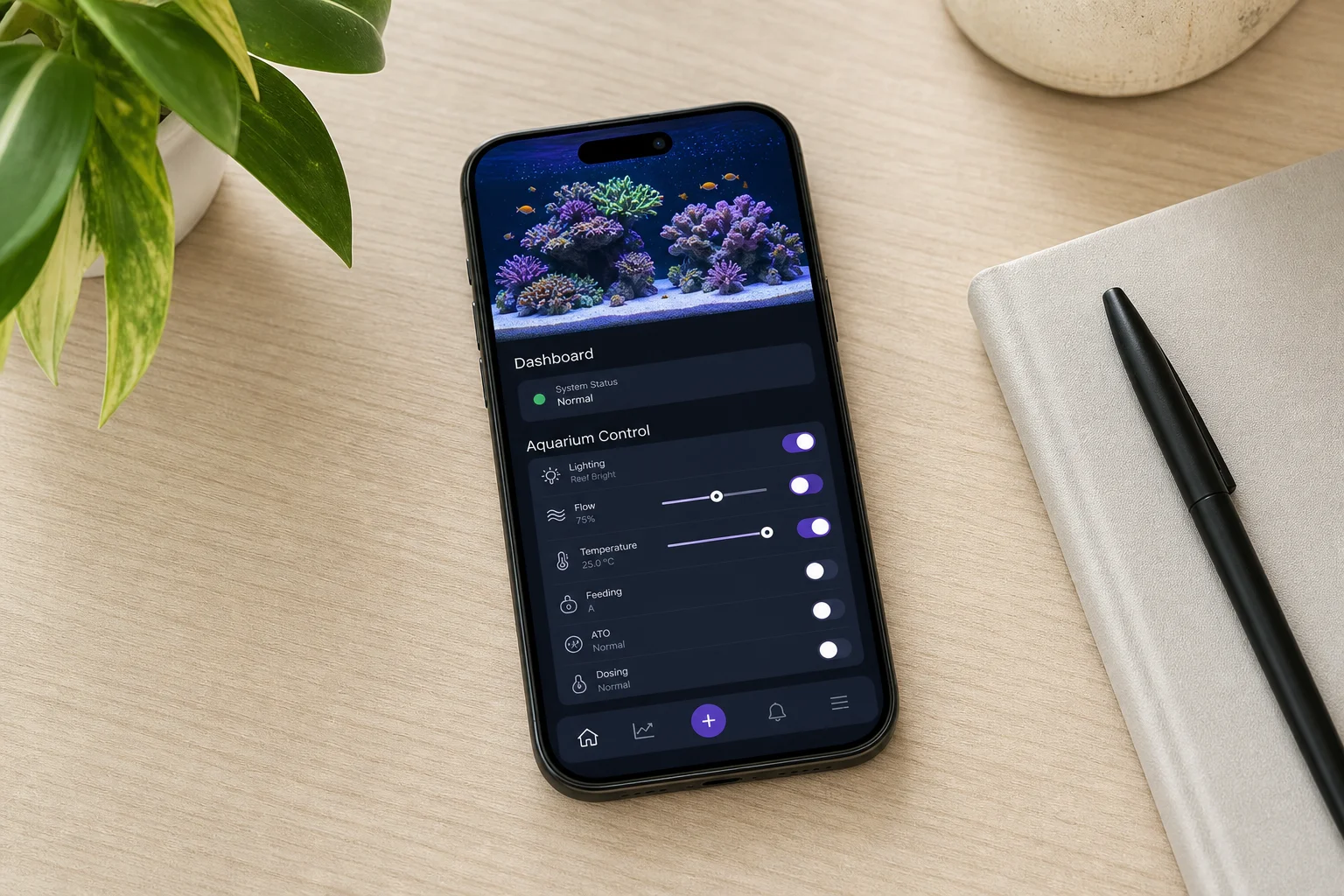 Smartphone som visar Fusion-appen för akvariekontroll på ett skrivbord