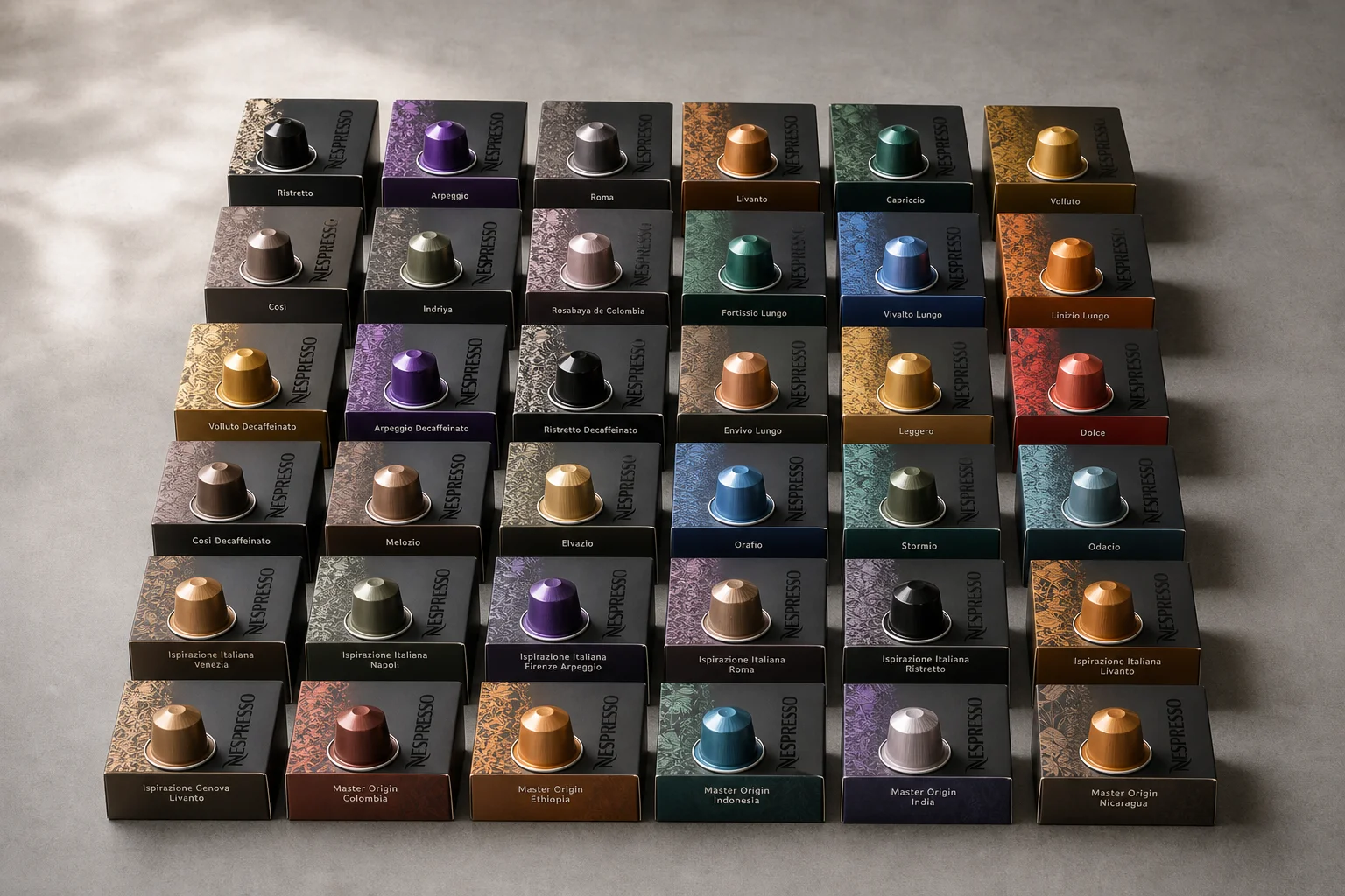 36 Nespresso OriginalLine capsules arranged in rows on grey surface