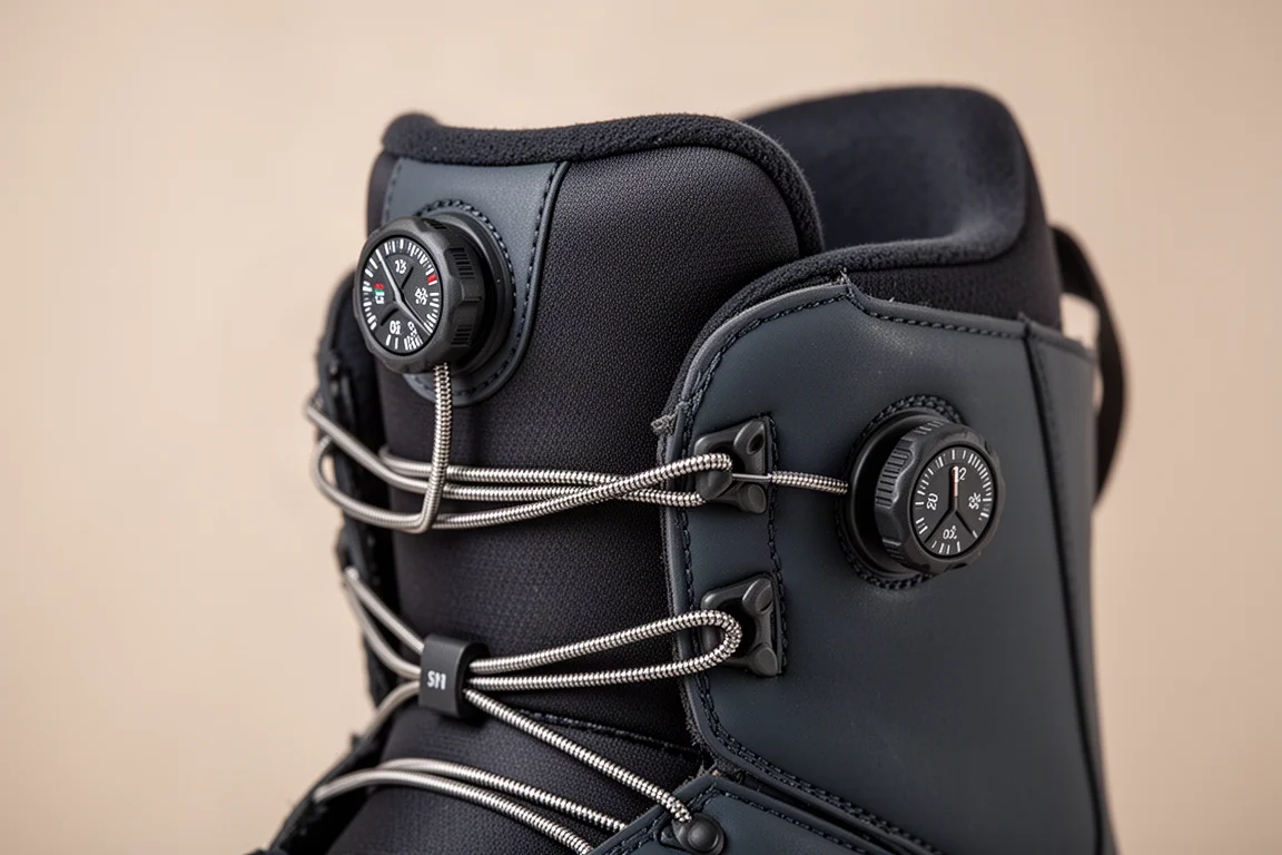 Dual dial closure dials on the tongue and side of a snowboard boot