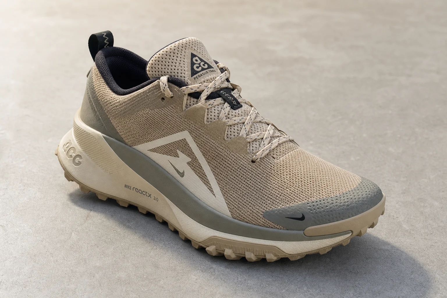 Seven trail running and hiking shoes arranged on concrete surface