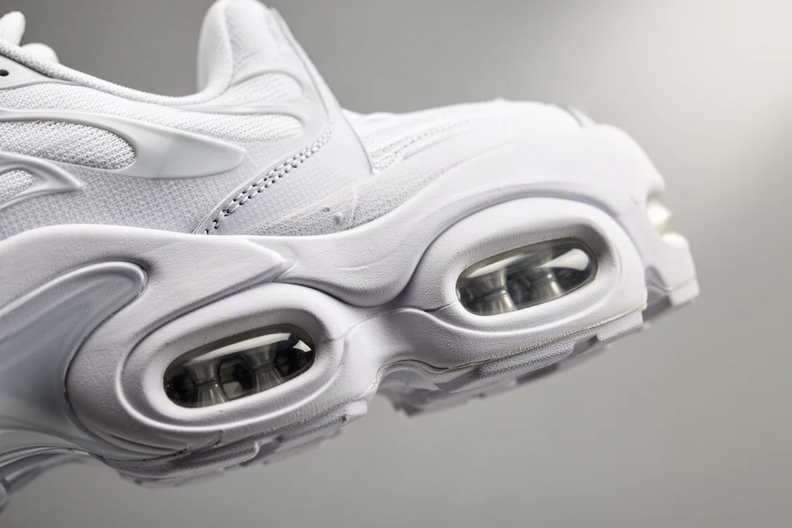 Close-up of a thick foam midsole with visible air pods under the forefoot