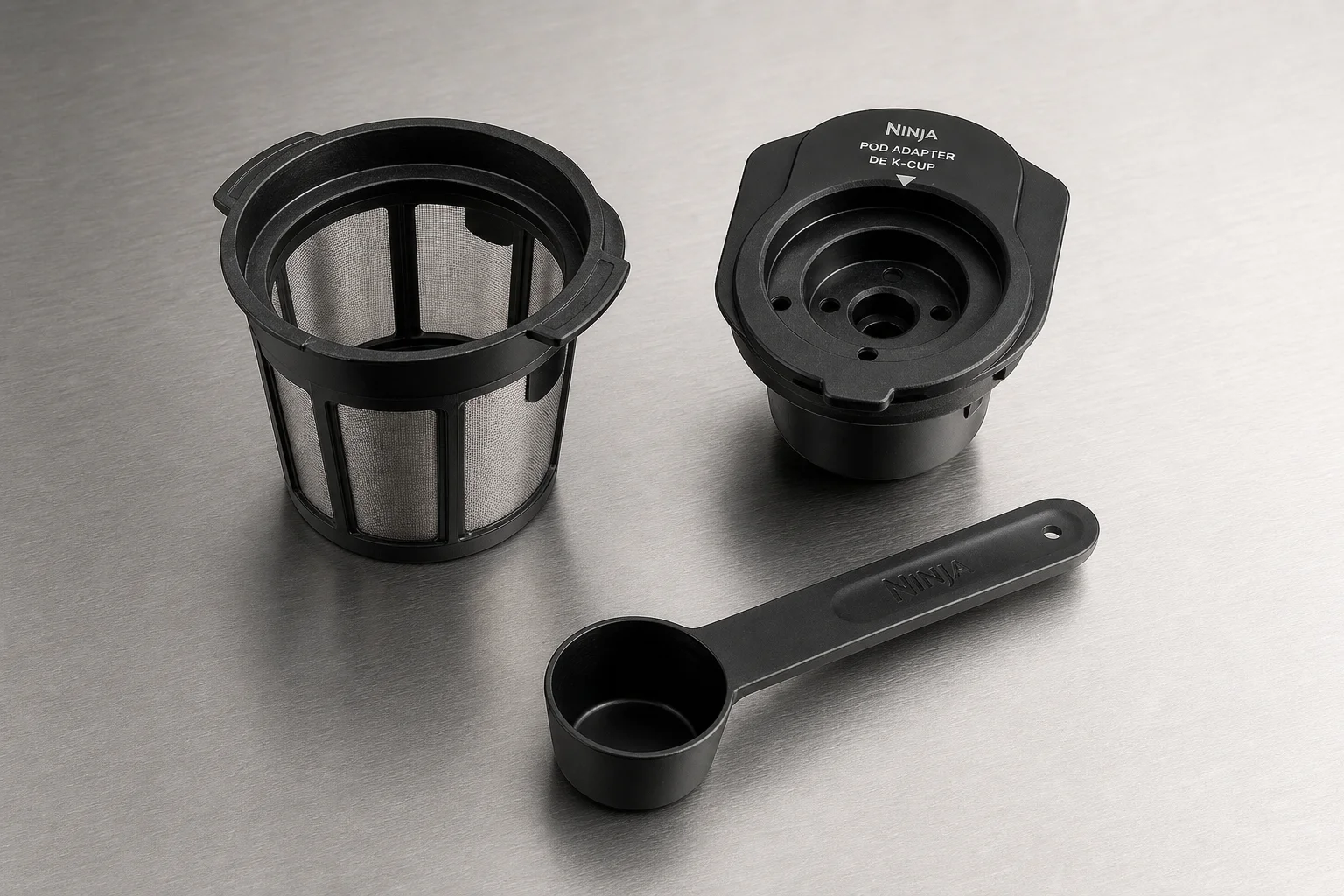 Reusable filter basket, K-Cup adapter, and scoop components displayed separately